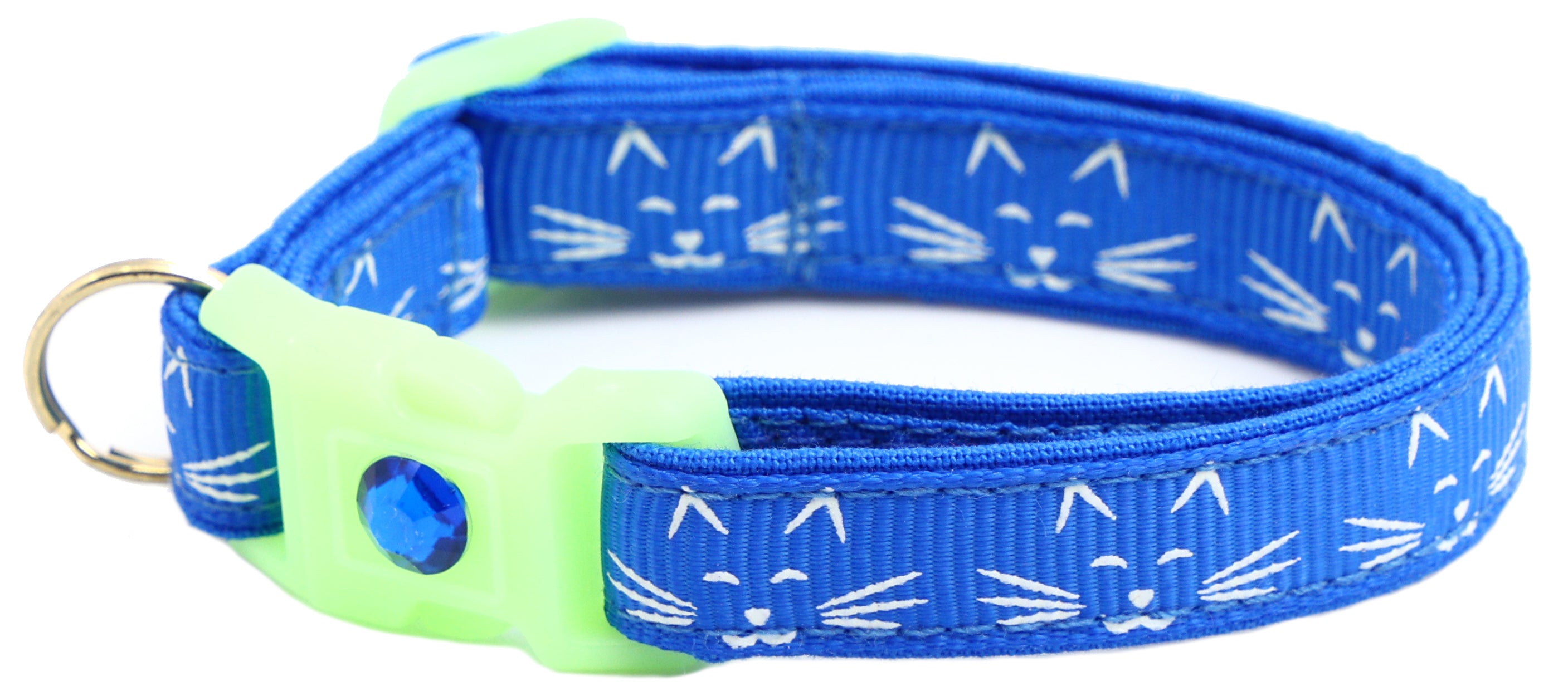 A glowing cat faces breakaway collar made of reinforced cotton, featuring a bell and charm, perfect for nighttime visibility.
